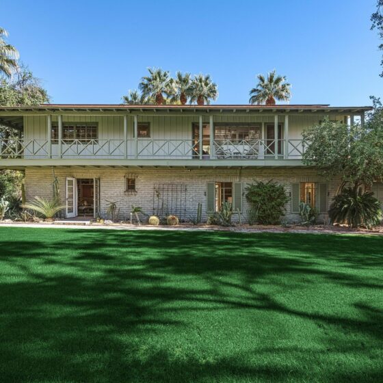 El Sueno seen from the lawn, its wraparound second-story balcony running the length of the facade, Old Las Palmas, Palm Springs