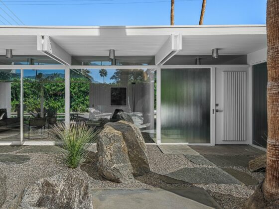 The Wexler Residence in Wexler White with post-and-double-beam roof and desert boulder landscaping, Movie Colony East, Palm Springs