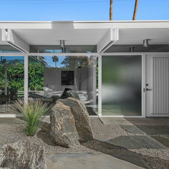 The Wexler Residence in Wexler White with post-and-double-beam roof and desert boulder landscaping, Movie Colony East, Palm Springs